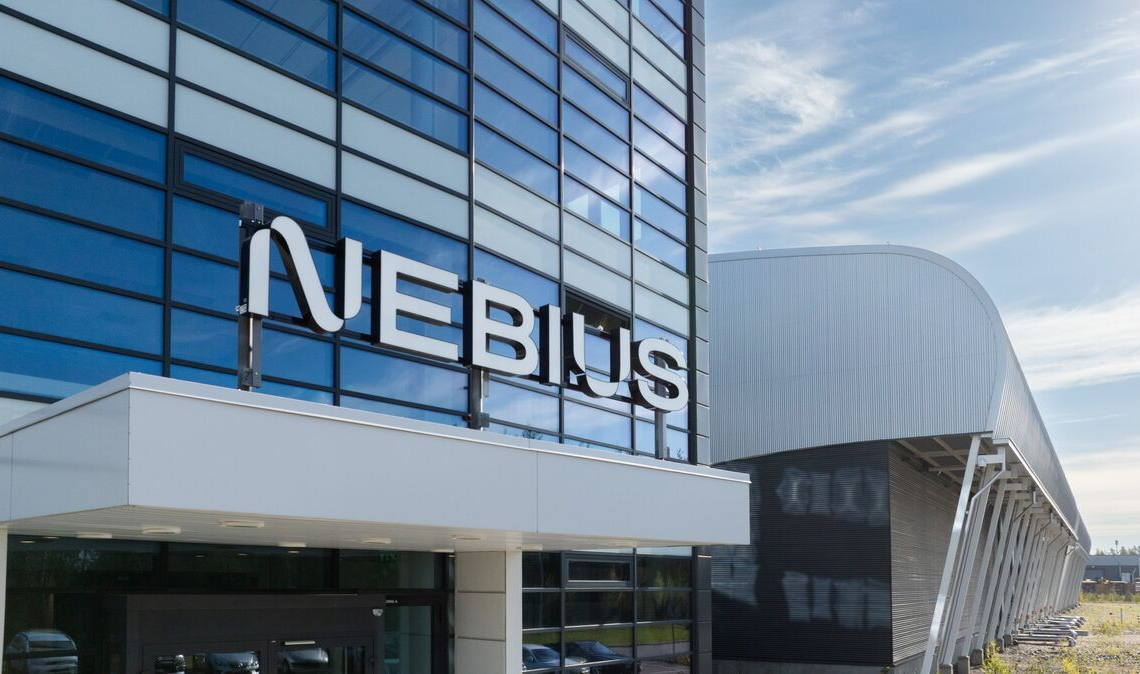 Nebius branding graphic showing logo on modern office building with glass facade.
