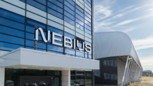 Nebius branding graphic showing logo on modern office building with glass facade.